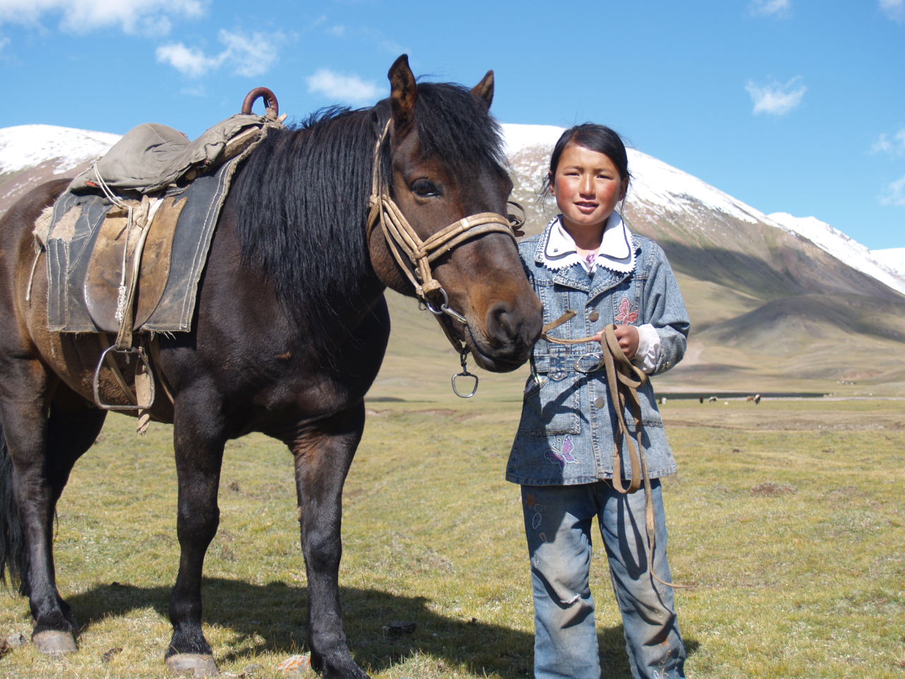 Young Mongolian Girl with her horse